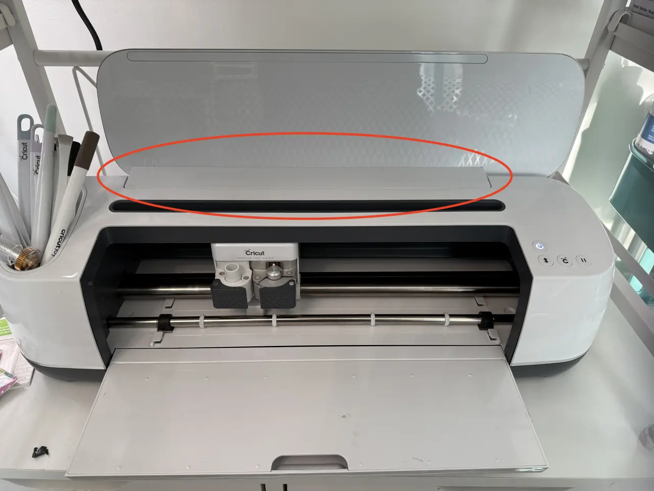 Image showing the cover to remove on a Cricut Maker
