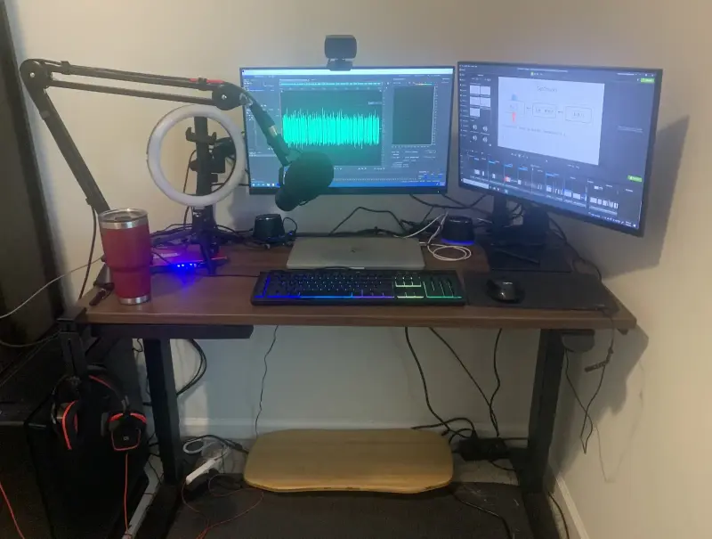 Photo of my working space - desk, monitors and microphone